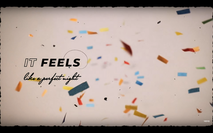 The opening lyric, “it feels like a perfect night”. Italic caps from Montserrat in both outline and filled paired with the script font Mr Sheffield.