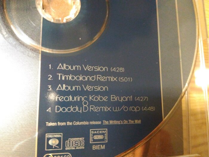 Compact disc with track names set in Dana Line