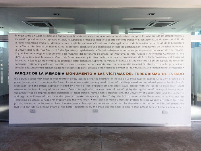 Wall with a bilingual description of the park and its objective