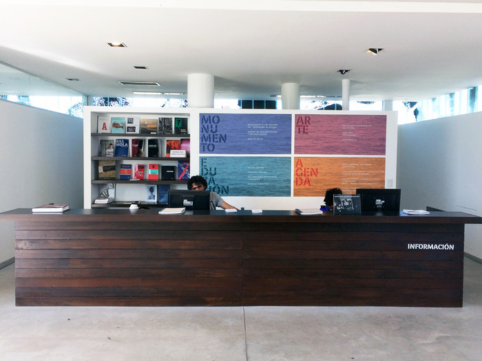 Reception desk with the names of the park’s four focus areas shown in Perec Ludique Pochoir, with 