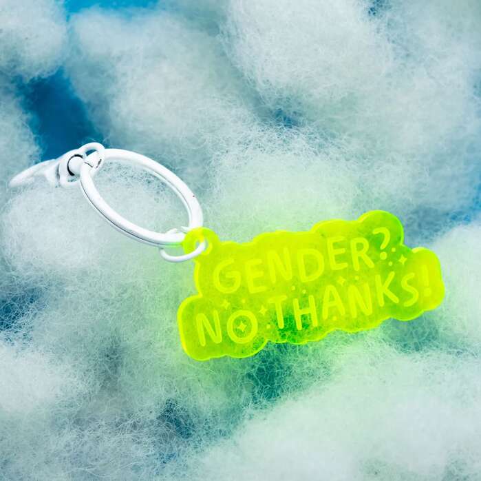 Ohno Softie Regular etched into a neon green keychain that says “Gender? No Thanks!”