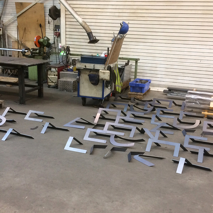 A stack of freshly produced letters at the Boeg Nautic factory, waiting for their coating.