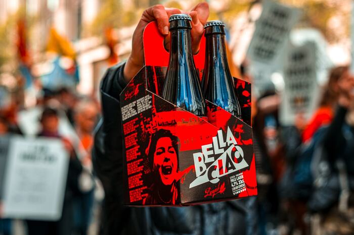 Hero image. Four bottles pack raised in a demonstration