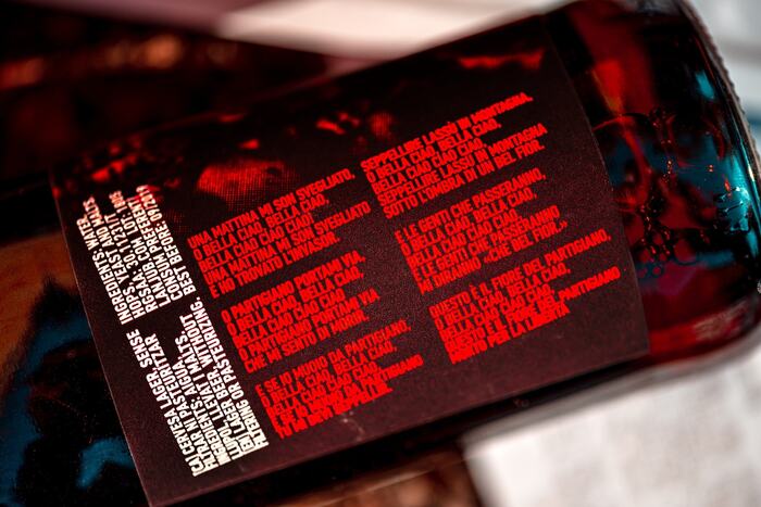 Close up of the beer label showing the lyrics of the Bella Ciao song