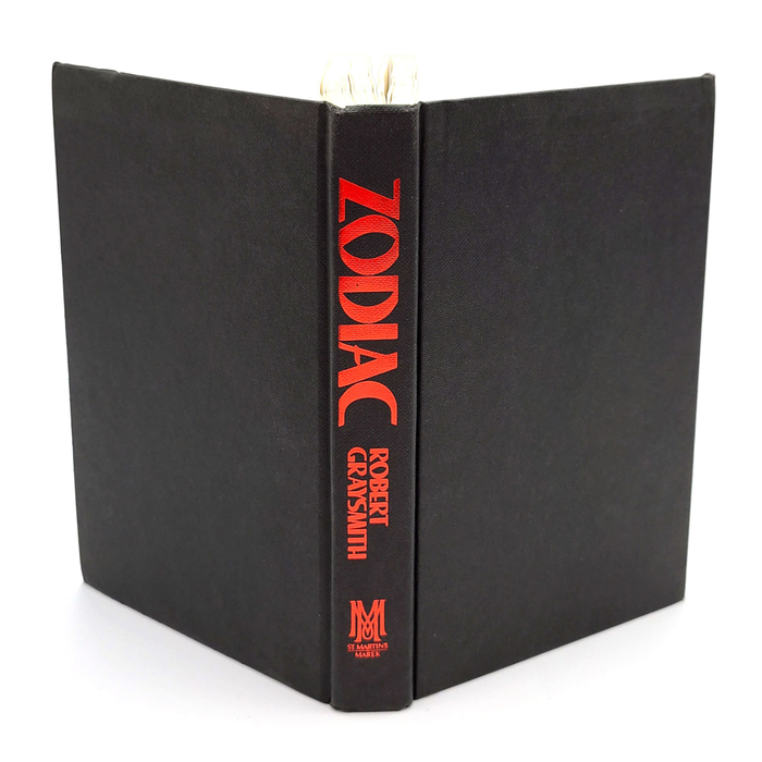For the spine of the hardcover, both the book's title and author's name are set in Lee Bold, in a metallic-red on black cloth.