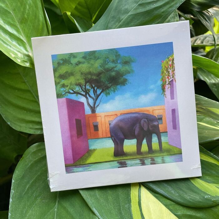 Album cover with an elephant painted by Peter Chan