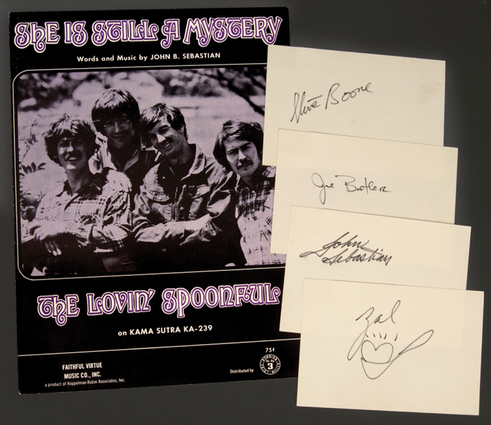 From GottaHaveRockAndRoll:




Lovin’ Spoonful band members John Sebastian, Zal Yanovsky, Steve Boone, and Joe Butler have signed 6×4 cards, one each, in black felt tip pen. Yanovsky has also added a drawing of a heart in a spoon. Accompanied by the sheet music for “She Is Still A Mystery,” written by John Sebastian. Sheet music measures 9×12.