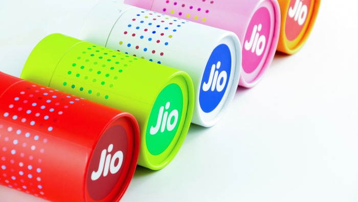 The Jio logo on cylindrical set up boxes. Packaging design by JUJIN New York.