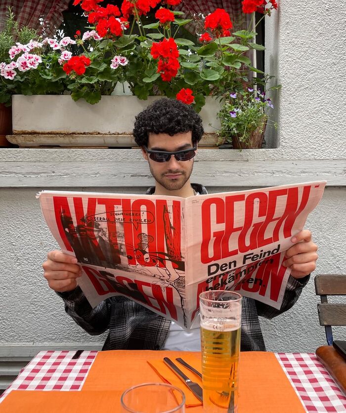Anatole Couteau, designer of LL Ruder Plakat, enjoying his copy of Fabrikzeitung.