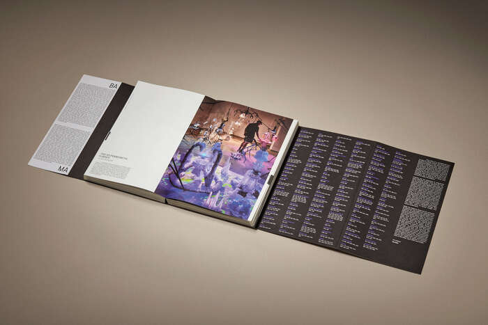 Open catalogue with front and back fold-out wayfinding indexes shown