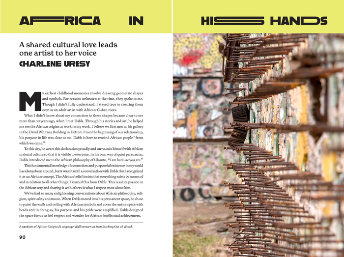 A spread from the book, title in modified Alfarn. The photo is of a work called Iron Sticking Out Of Wood, part of the African Scripted Language Wall