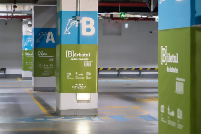 Parking bookmark campaign by Geometry Global agency: parking garage signage doubling as book vouchers at the Veranda Mall location
