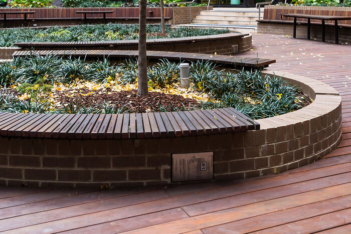 Some engraved lettering can be seen on the bench in the foreground