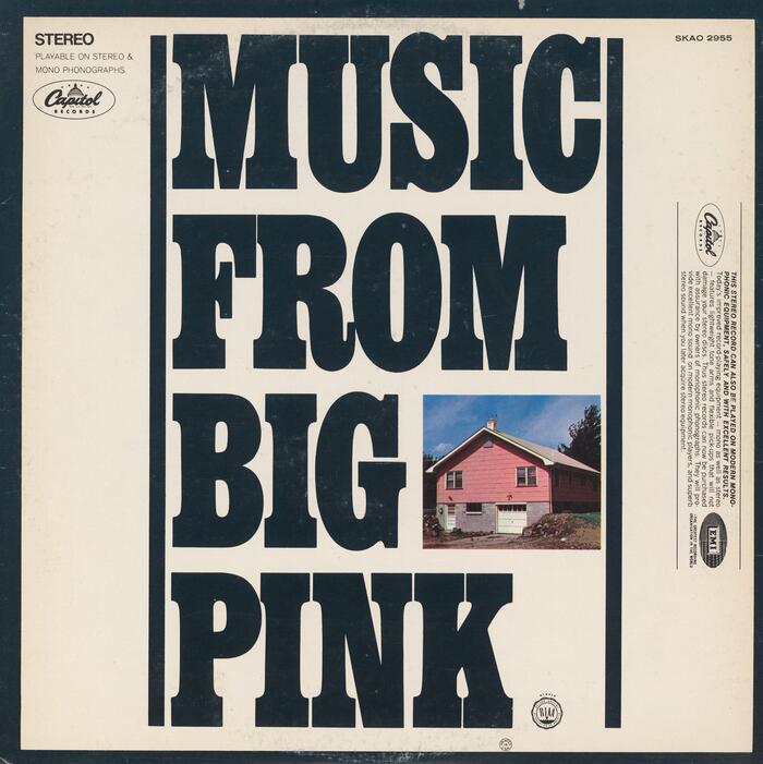 Back cover (1973 reissue). The album was named after “Big Pink”, a house shared by band members Rick Danko, Richard Manuel and Garth Hudson in West Saugerties, New York, where some of the music was composed. Smaller text is set in  and .