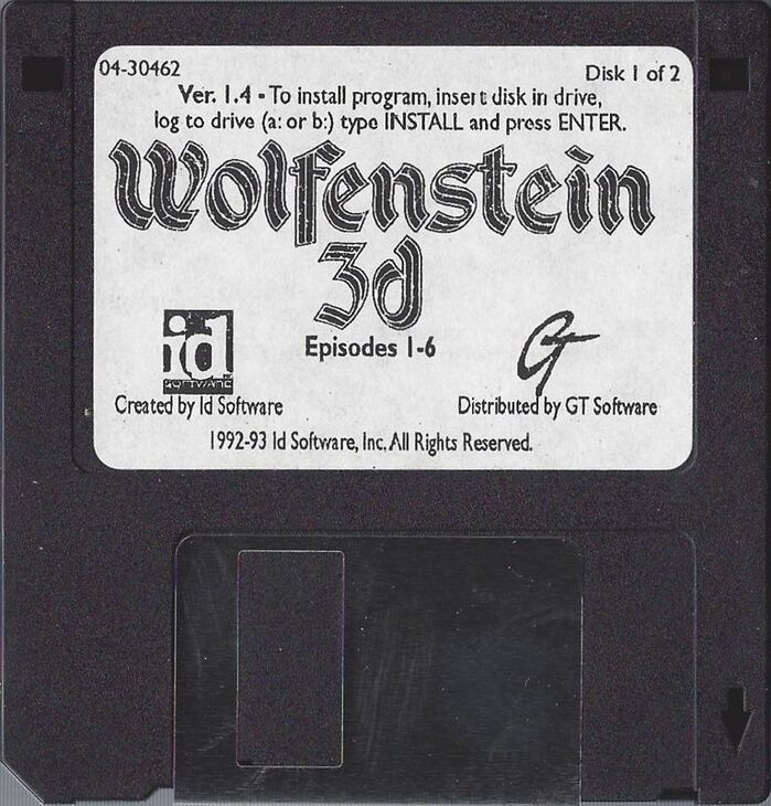 Media for Wolfenstein 3D (DOS) (Floppy Disk Version, 1992, distributed by GT Software, v1.4 (04-30462)). Additional text on label is set in Gill Sans.