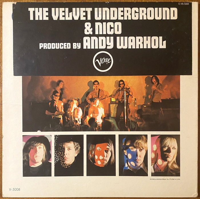 Back cover of the original 1967 pressing. From Wikipedia:




When the album was first issued, the main back cover photo (taken at a performance of Warhol's event Exploding Plastic Inevitable) contained an image of actor Eric Emerson projected upside-down on the wall behind the band. Having recently been arrested for drug possession and desperate for money, Emerson threatened to sue over this unauthorized use of his image, unless he was paid. Rather than complying, MGM recalled copies of the album and halted its distribution until Emerson's image could be airbrushed from the photo on subsequent pressings. Copies that had already been printed were sold with a large black sticker covering the actor’s image.