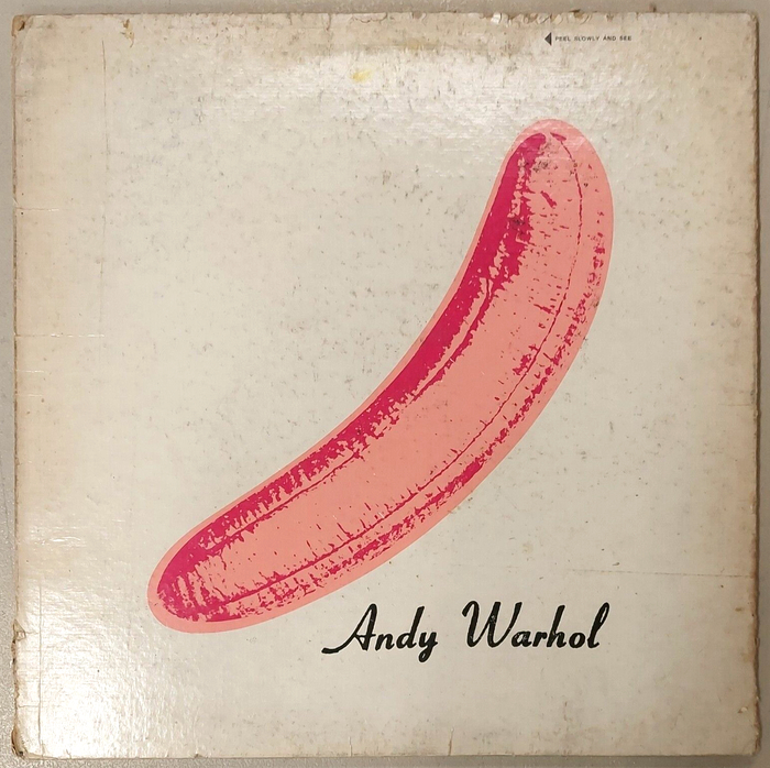 Cover with peeled back sticker, revealing a flesh-colored banana underneath