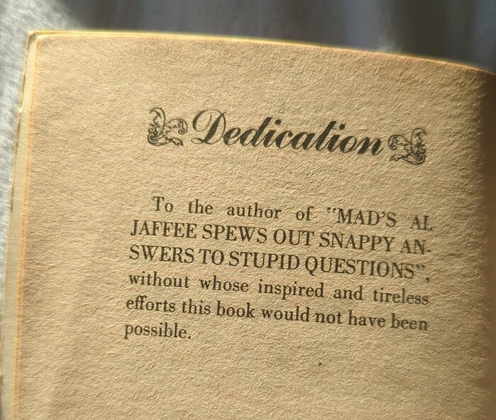 In the dedication page, the heading is set in Commercial Script between ornaments, and the text in Bodoni.