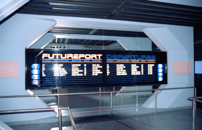 Full view of the Futureport departures board, circa 1998. The Departures text is rendered in outline/contour.