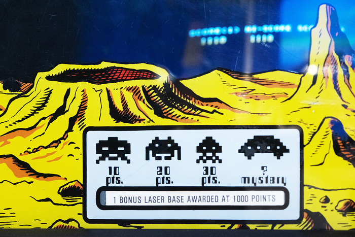 On Midway’s arcade machine, the points-per-invader on the monitor bezel are set in Countdown.