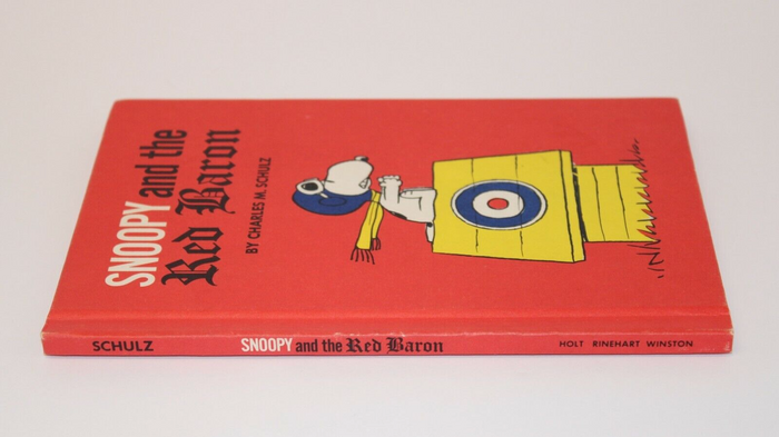 Book spine without jacket (identical design), using same typefaces as the front cover.