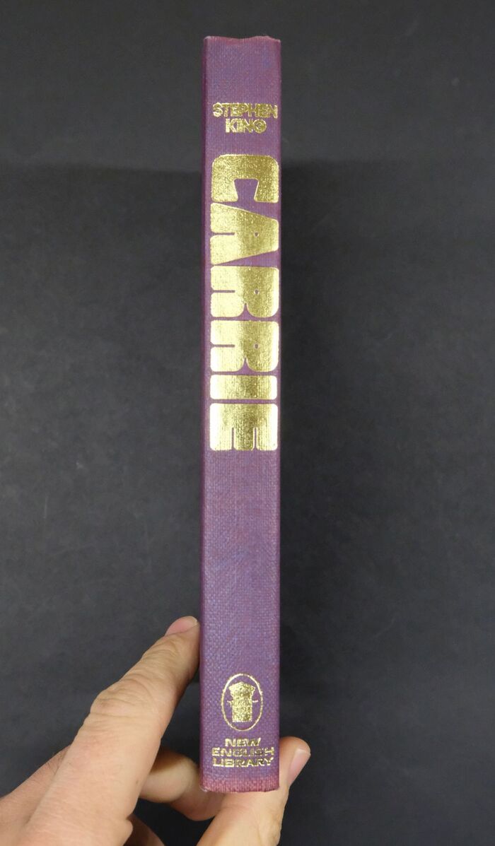 Gilt lettering on spine of purple cloth hardcover