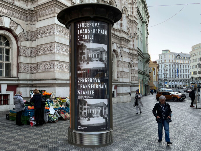 Posters on a column in Prague’s cityscape