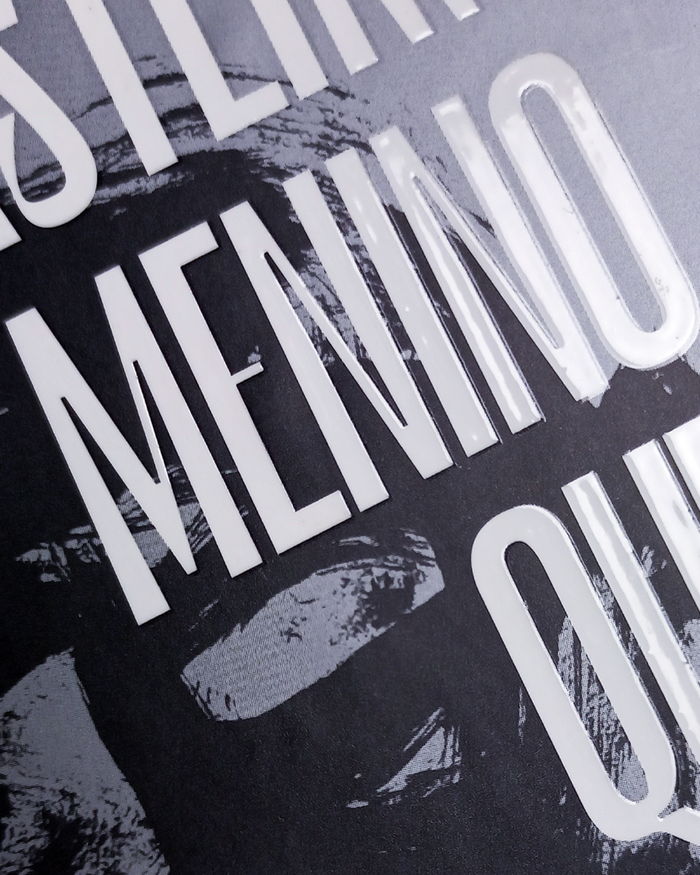 A close up of the embossed title showing the letterforms of Le Murmure with spot varnish