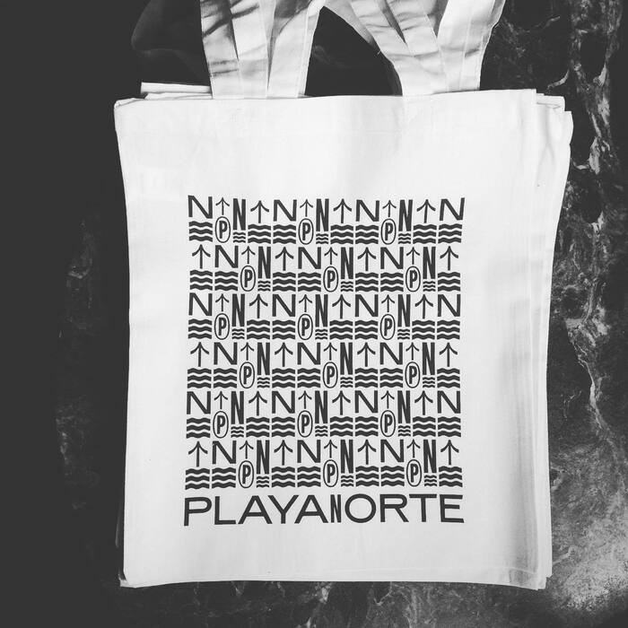 Band merch: On the tote bag, the widths are reversed, with a single condensed N amidst extended letters.