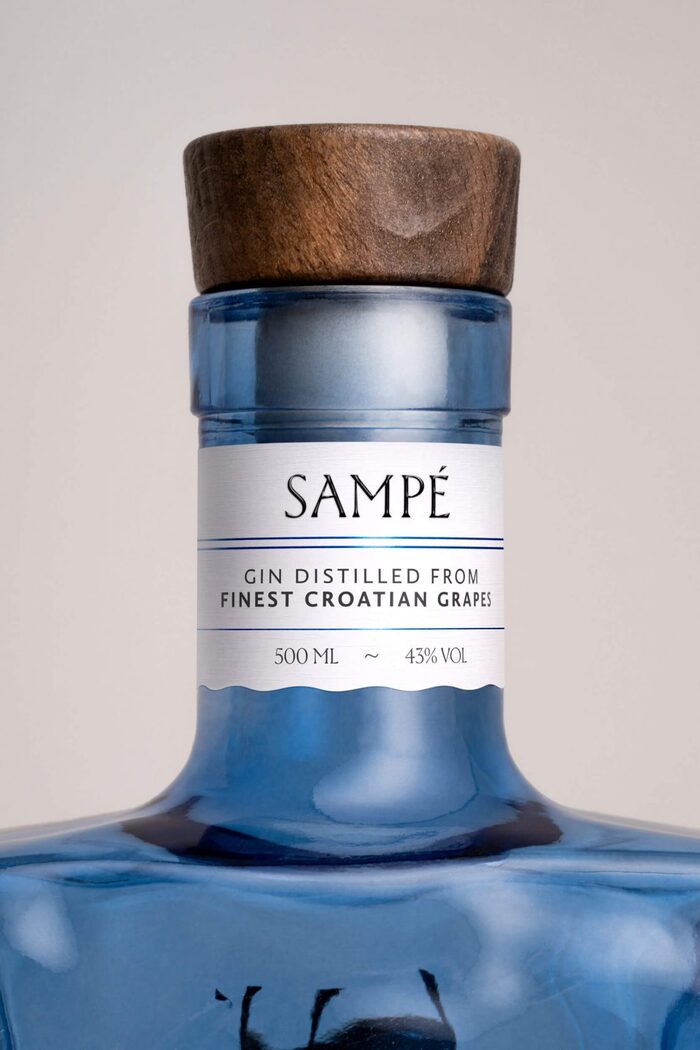 Bottle neck with the brand name in raised ink