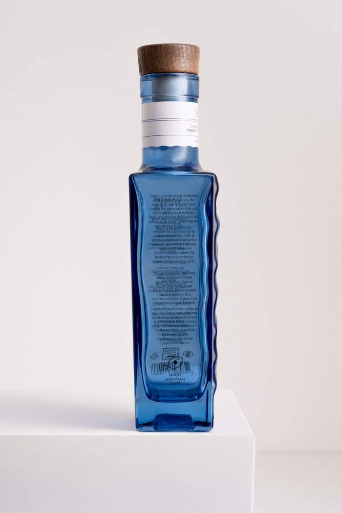 The brand story as shown on the side of the bottle, in English and Croatian, and set in Rector combined with Brioni Sans