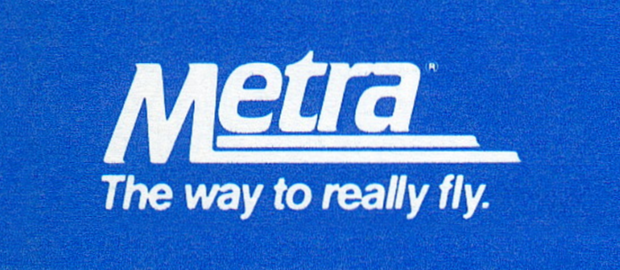 The Metra wordmark with the slogan “The way to really fly”