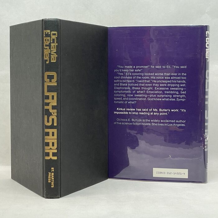 Book cover with golden spine lettering; back panel of dust jacket with text in 