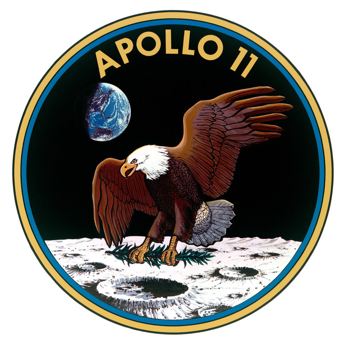 Apollo 11 badge with a bald eagle planting a branch on the Moon