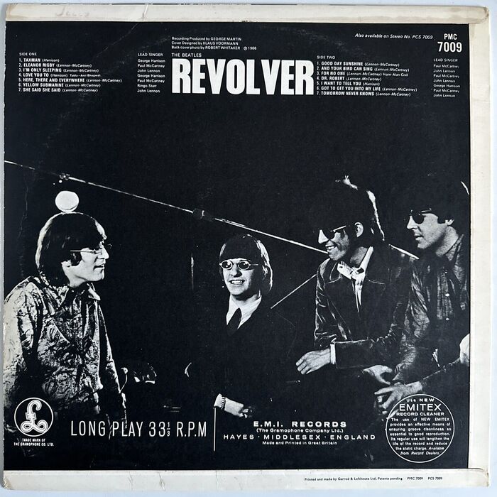 Back cover of the UK release by Parlophone (PMC 7009), with a photo taken by Robert Whitaker during the filming at Abbey Road on 19 May. Here the title is rendered in caps from , with the track names and credits set in several styles from . The info at the bottom is set in the  series, including Condensed and Extended styles. The printer’s credit is in .