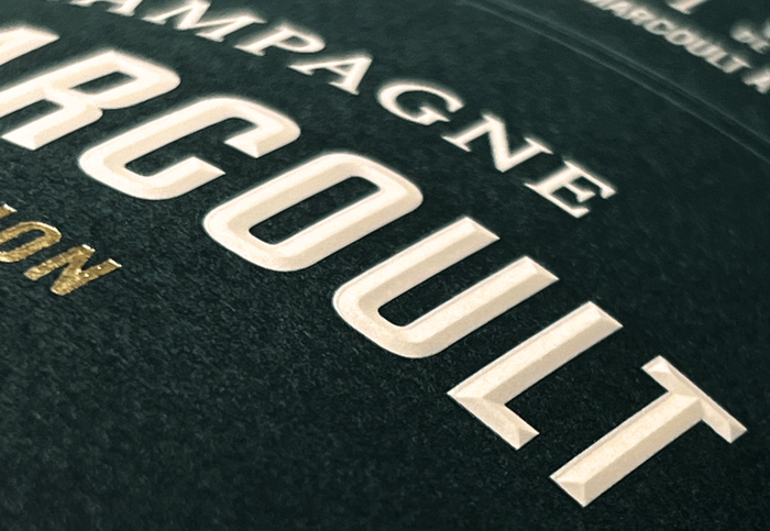 3D effect through relief embossing and foil gilding