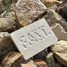 “Fait.” stone carving