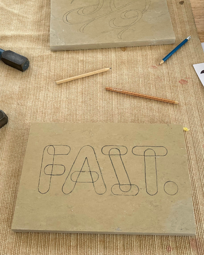 “Fait.” stone carving 2