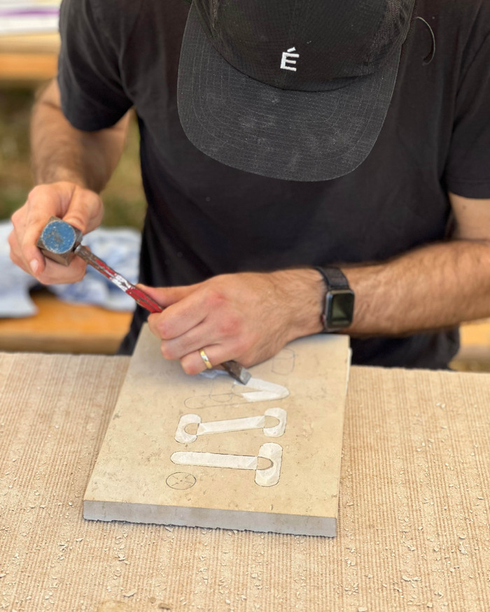 “Fait.” stone carving 3