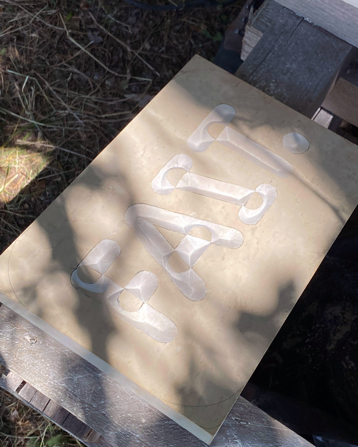 “Fait.” stone carving 4