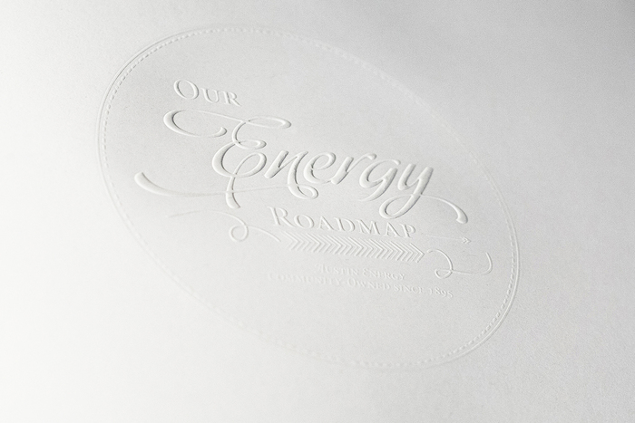 Page 1 of the Commemorative Book is a fly sheet with a white-on-white foil emboss stamp.