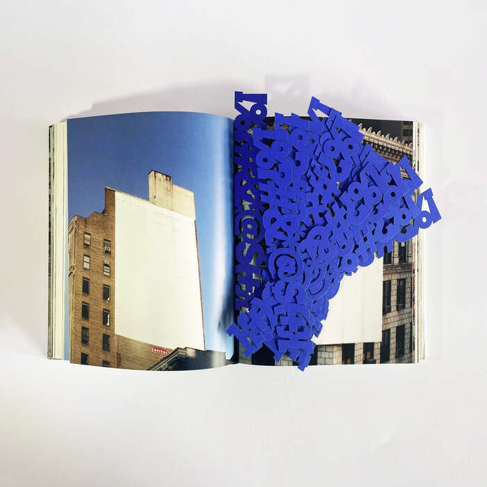 The book in the image is ENDCOMMERCIAL: Reading the city by SBA/Scheppe Böhm Associates, Hatje Cantz 2002.