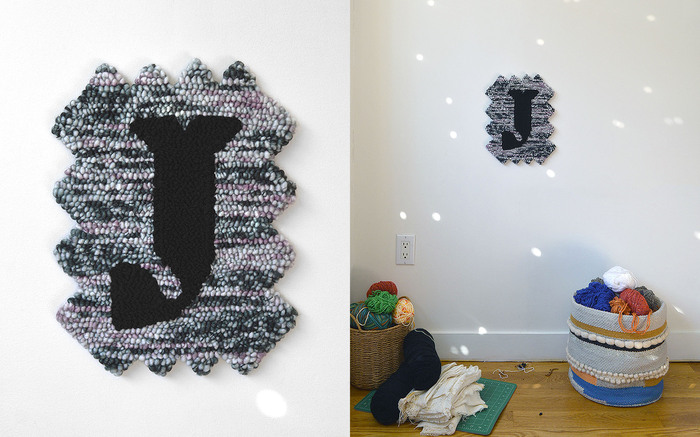 J set in  Master Bold (designed by  and released by ) at 1,000 pt on a Jagged-edged Jewel background