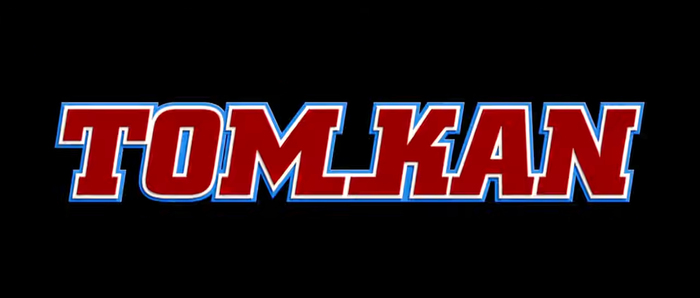 Bold, slanted, with double contour and extended baseline serifs, for Tom Kan, Director of Typography