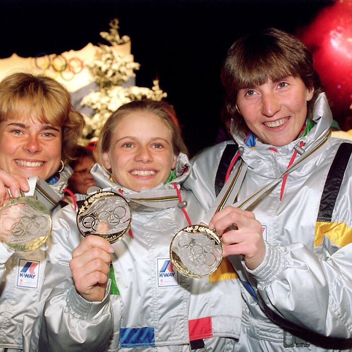 French biathletes Anne Briand, Veronique Claudel and Corinne Niogret won in the women&rsquo;s 3&times;7.5 km team relay on 14 February 1992 in Les Saisies and proudly display their gold medals &ndash; with text in Peignot. The medals were designed under the direction of Marie-Claude Lalique.
