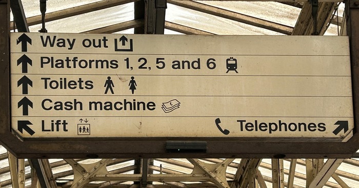 Sign at Exeter St Davids rail station, photographed in August 2024, showing its age &ndash; or in need of some cleaning at least
