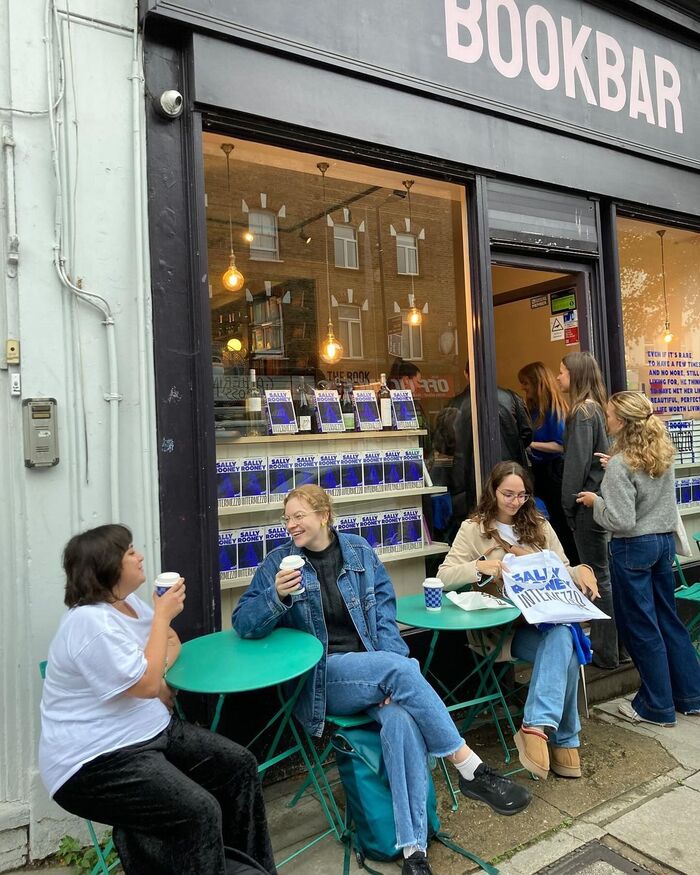 Early birds with promotional cups and plastic bags