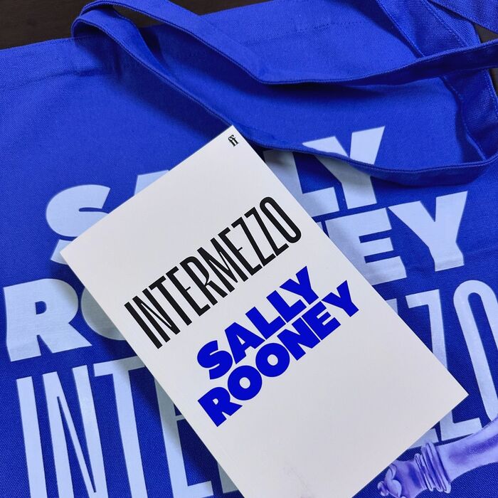 Review copy of the book, on top of a tote bag