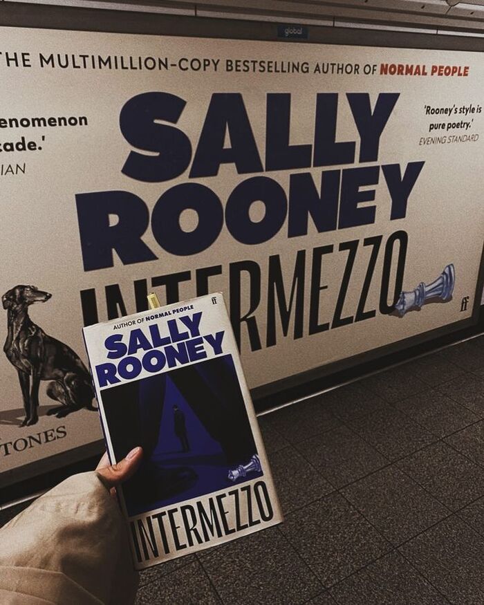 The book and an advert on the London Underground
