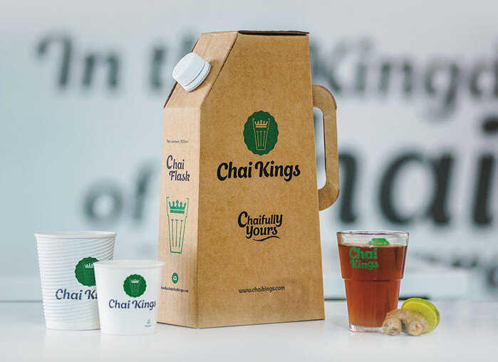 The logo and slogan on cups and a single-use flask